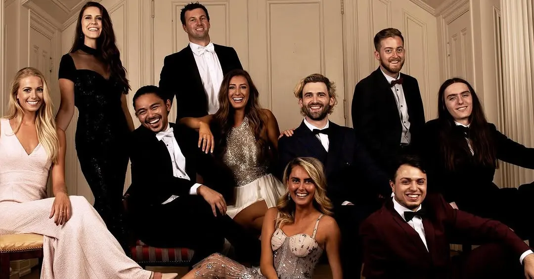 The Spectruss team smiling in formal wear in the Hunter Museum mansion
