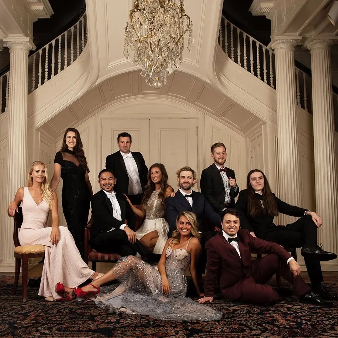 The Spectruss team in formal wear under a chandelier at the Hunter Museum of American Art, 2019